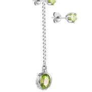 Long silver earring with a stone