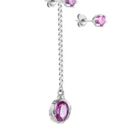 Long silver earring with a stone