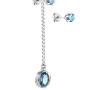Long silver earring with a stone