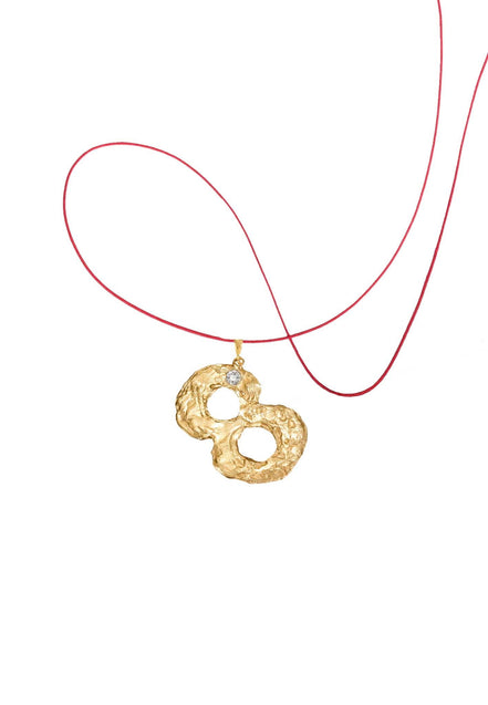 Gold number 8 pendant with a diamond. 14k gold