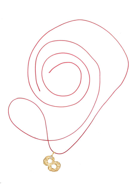 Gold number 8 pendant with a diamond. 14k gold