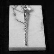 Silver pen with black diamond